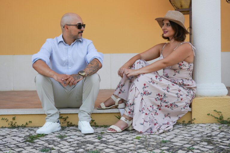 A couple enjoying a sunny day outdoors in Palmela, Setúbal, Portugal, with a relaxed and stylish vibe.